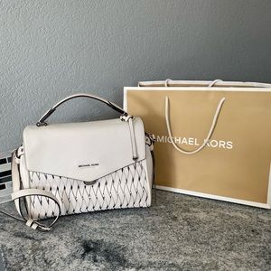 Beautiful Silver/Optic White bag with unique silver embellishments.